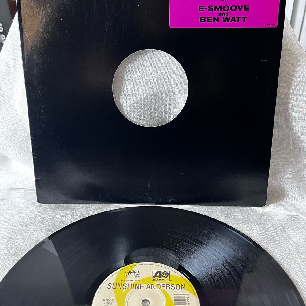 Black Vinyl Record with Pink and Yellow Labels